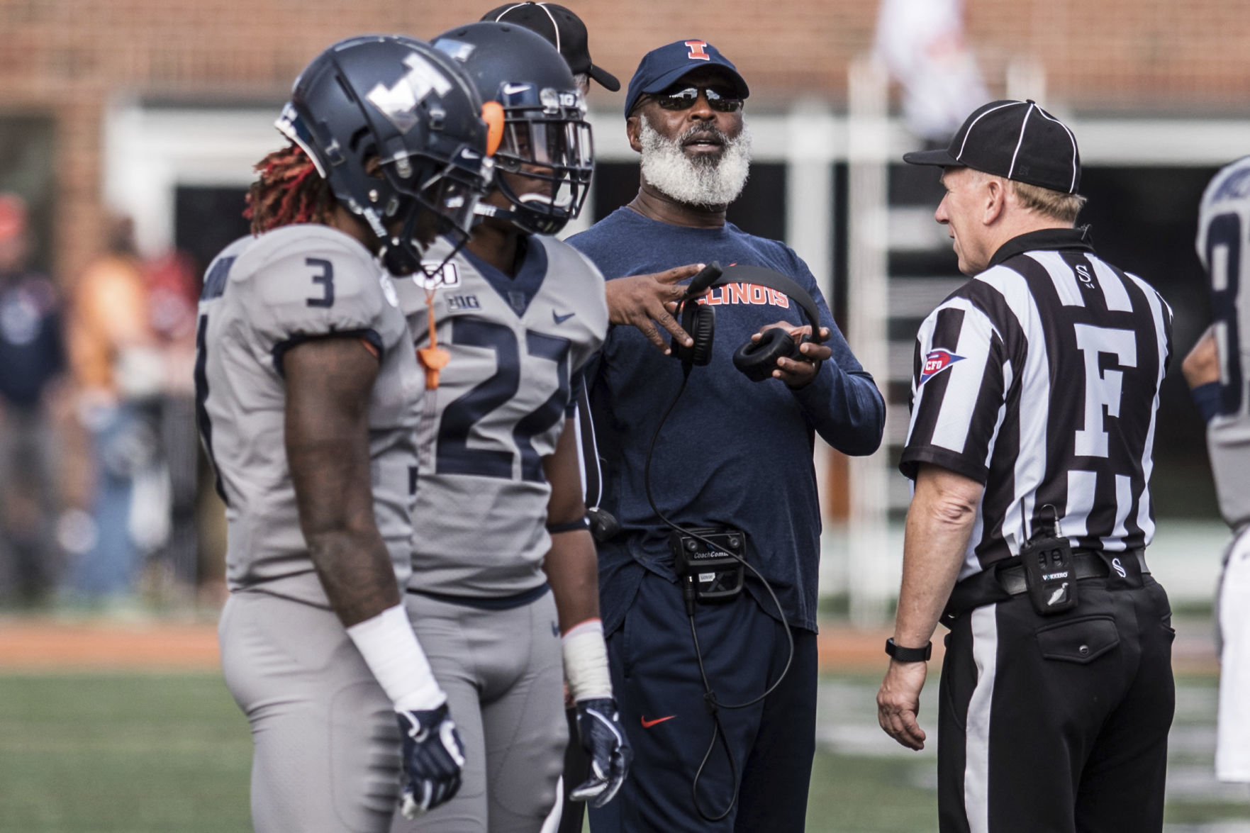 Lovie Smith talks with officials, AP photo